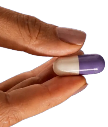 FLOW capsule held between fingers